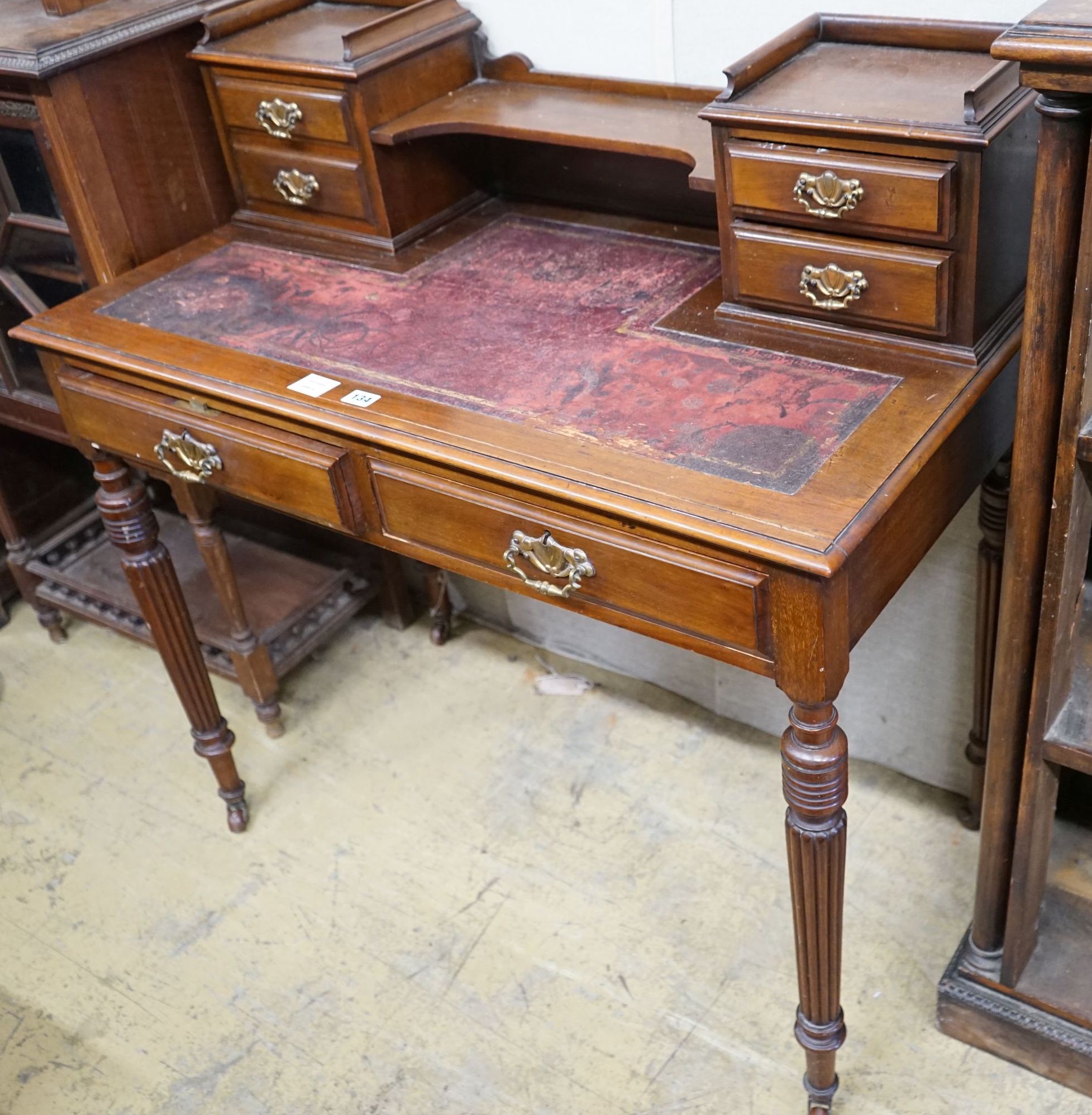 A late Victorian mahogany writing table, width 99cm, depth 52cm, height 100cm